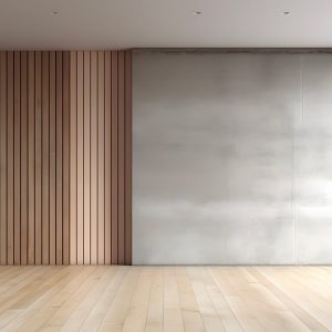 Una stanza vuota con un pavimento in legno e una parete in cemento. La parete è rivestita con pannelli fonoassorbenti in legno disposti in modo regolare. La stanza è illuminata da una grande finestra